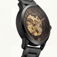 Luxury Black Skeleton Automatic Men’s Watch with Gold Open-Work Dial & Matte Steel Bracelet