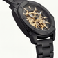 Luxury Black Skeleton Automatic Men’s Watch with Gold Mechanical Dial & Matte Steel Bracelet